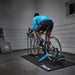 Man using the Tacx Booster Indoor Trainer at home 