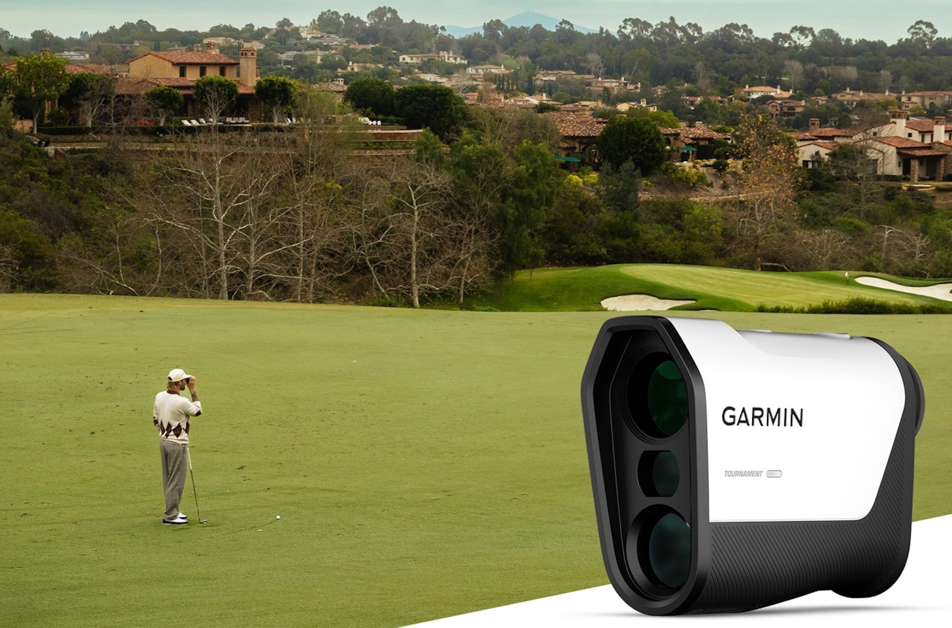 A golfer using a rangefinder on a golf course with an image of the Garmin Approach Z10 rangefinder in the foreground