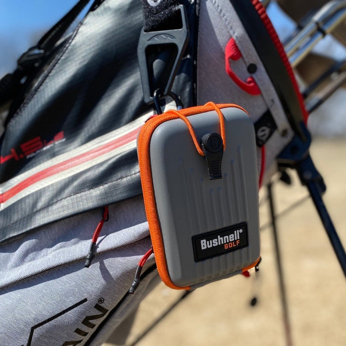 The Bushnell Pro X3 rangefinder case hanging from golf reviewer Marc's golf stand bag