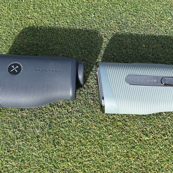 The Blue Tees Captain Air and Captain Pro golf rangefinders on a golf hitting mat