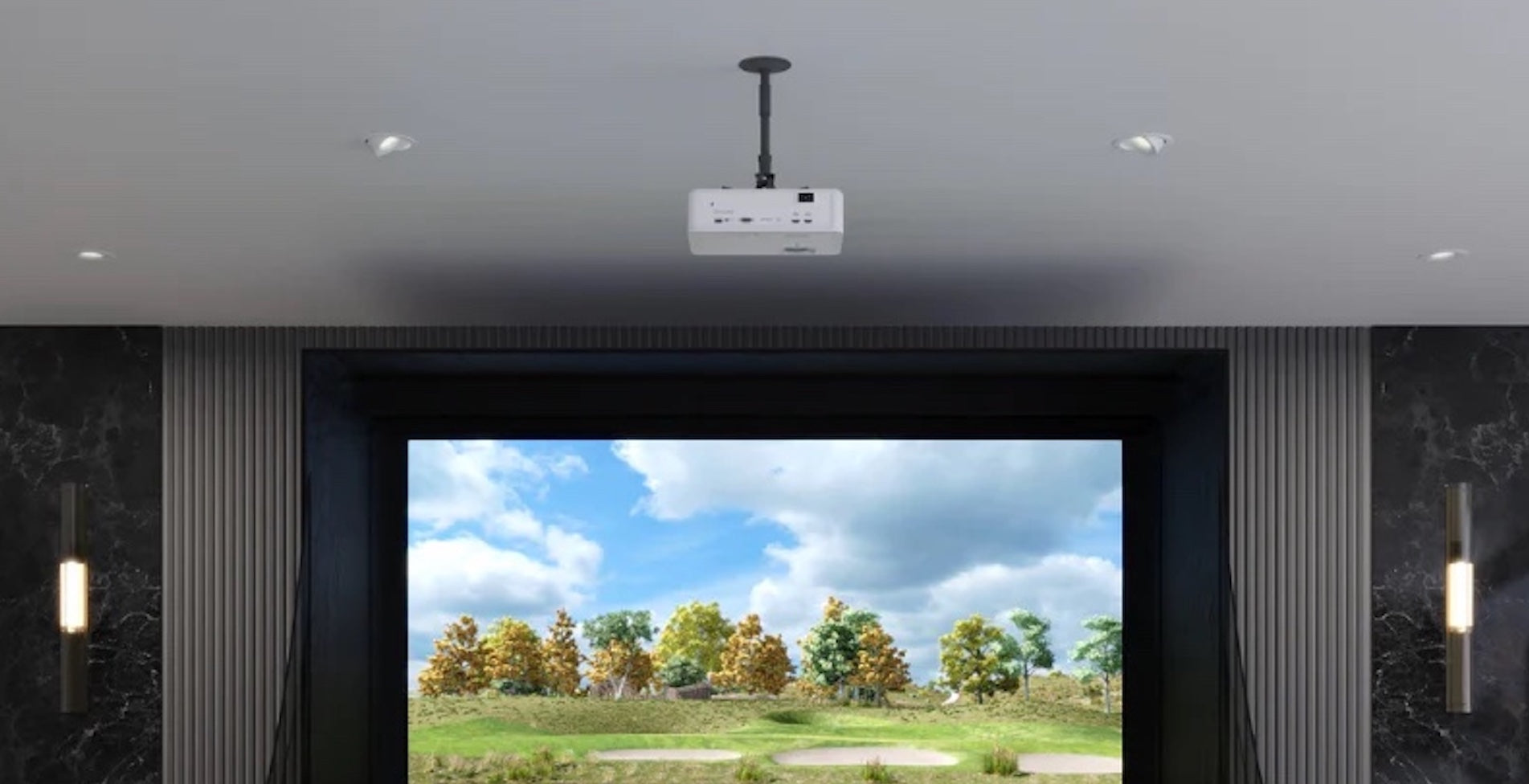 A golf simulator projector mounted to the ceiling in a home golf simulator with virtual golf course showing on the impact screen