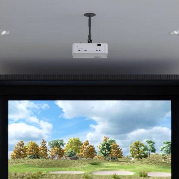 A golf simulator projector mounted to the ceiling in a home golf simulator with virtual golf course showing on the impact screen