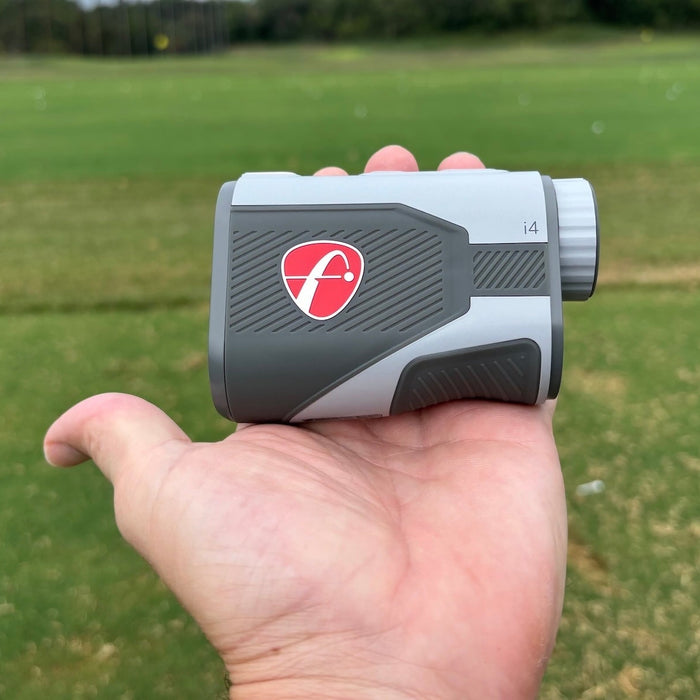 The FlightScope i4 rangefinder in golf reviewer Marc's hand on the course