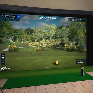 The GCQuad in a home golf simulator with Foresight Sports software on the screen