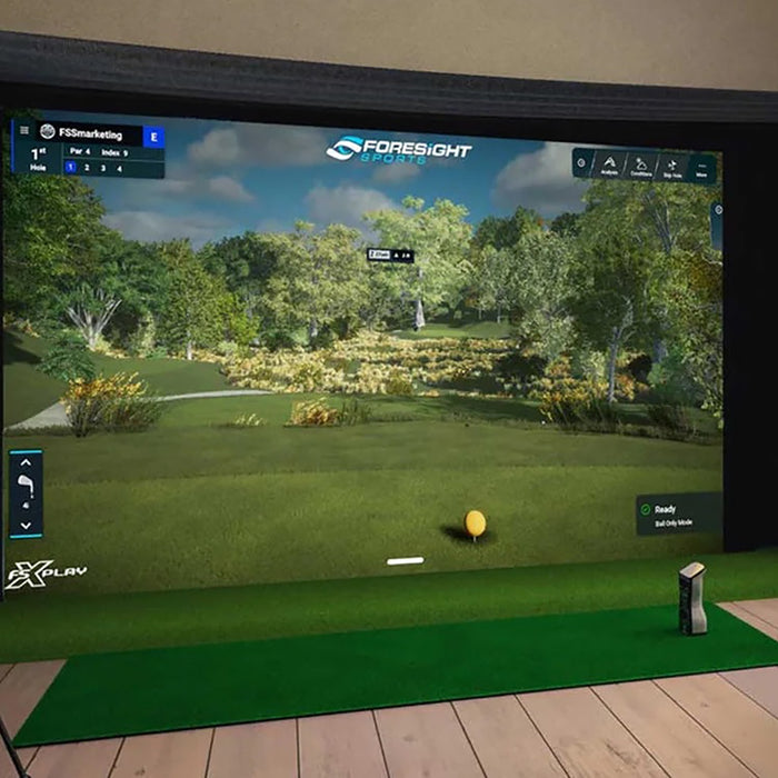 The GCQuad in a home golf simulator with Foresight Sports software on the screen