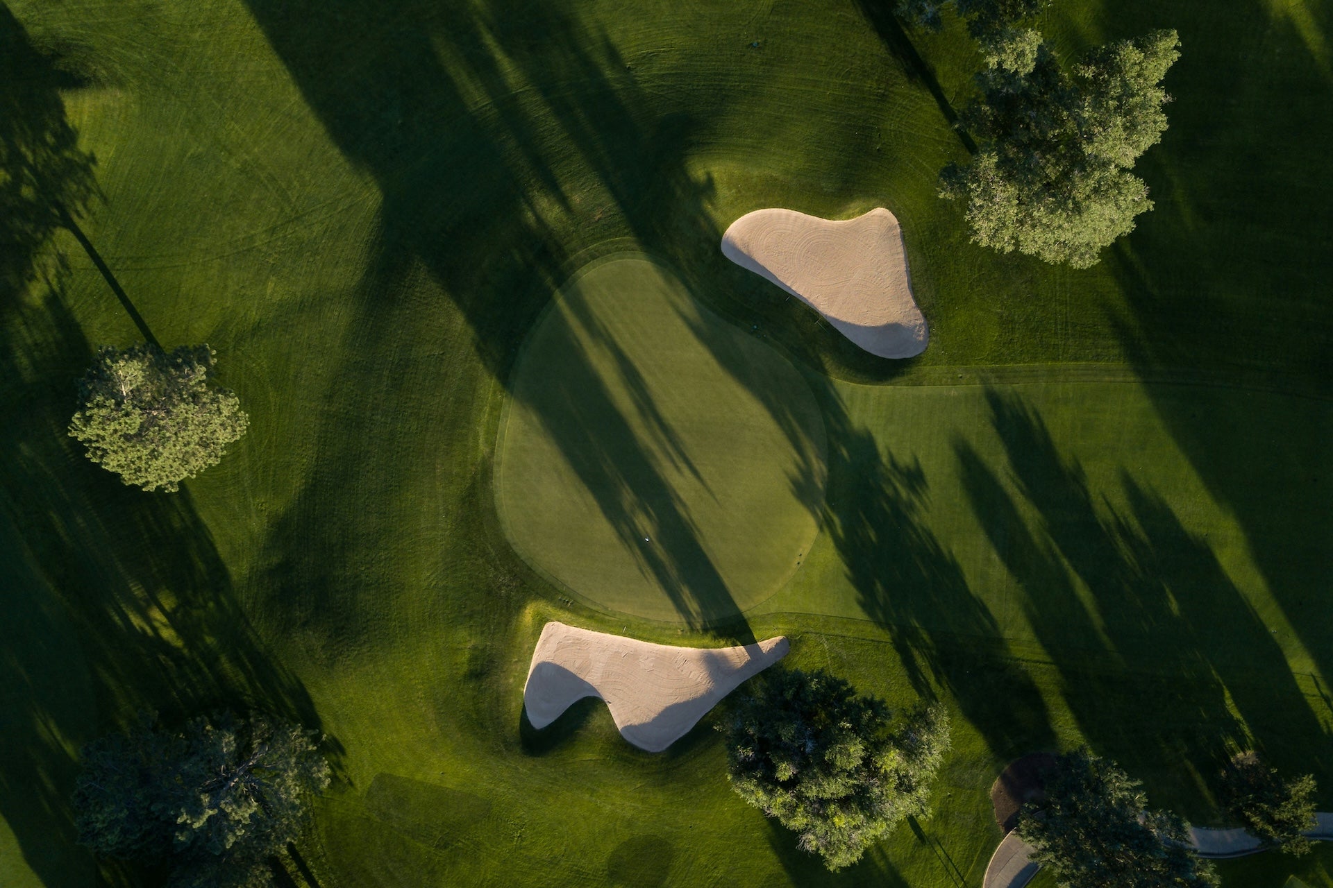 Arial view looking down on a golf course hole