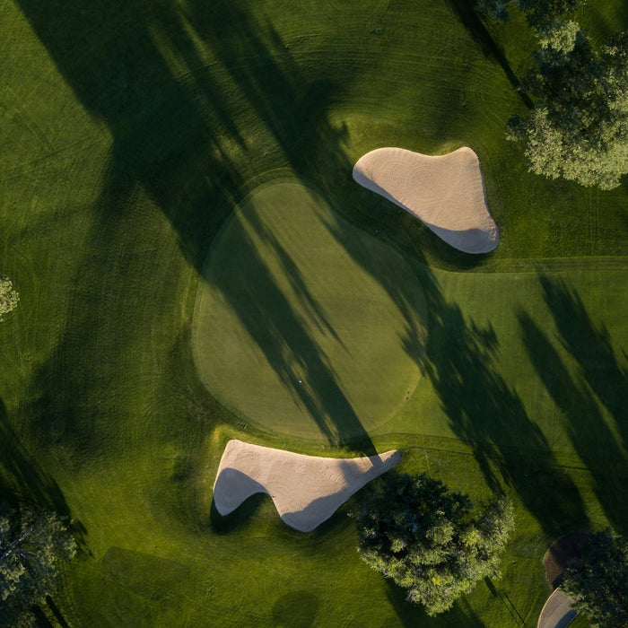 Arial view looking down on a golf course hole
