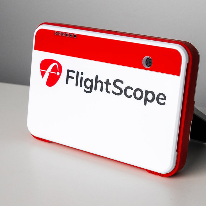 The FlightScope Mevo+ Launch Monitor set up on a white table