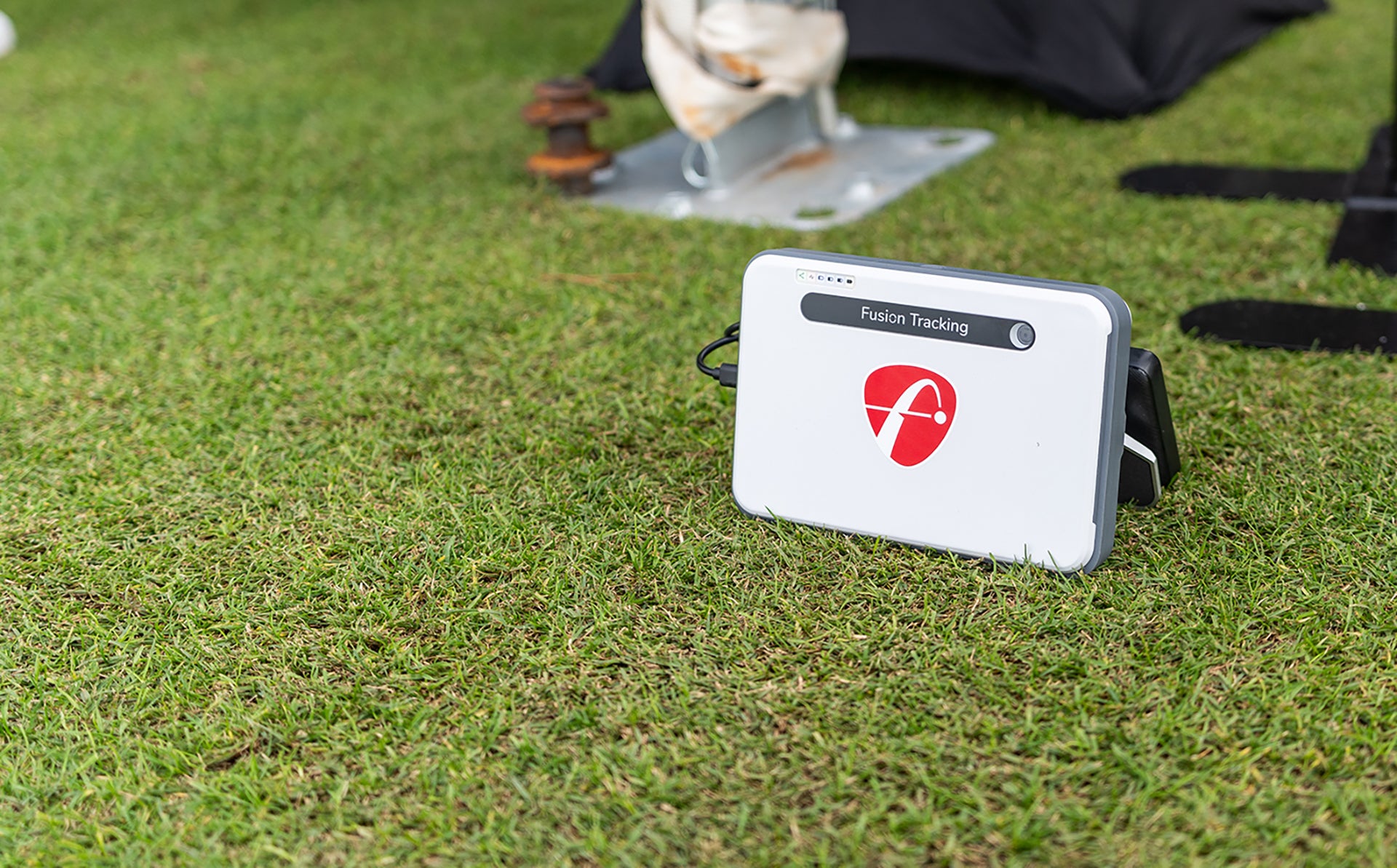 The FlightScope Mevo Plus Limited Edition launch monitor on the ground at the 2024 PGA Show