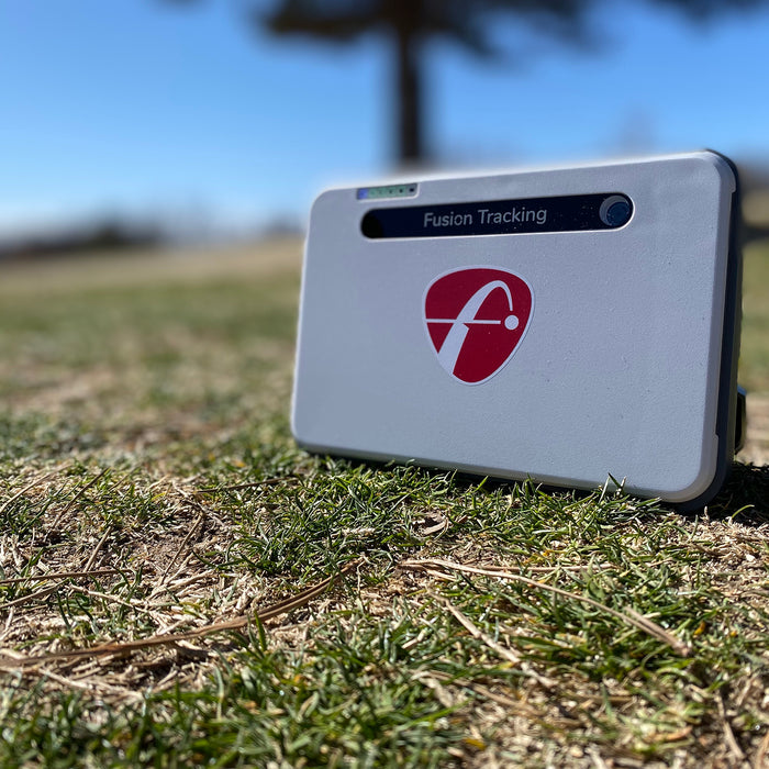The FlightScope Mevo+ Limited Edition setting on the grass at the golf course