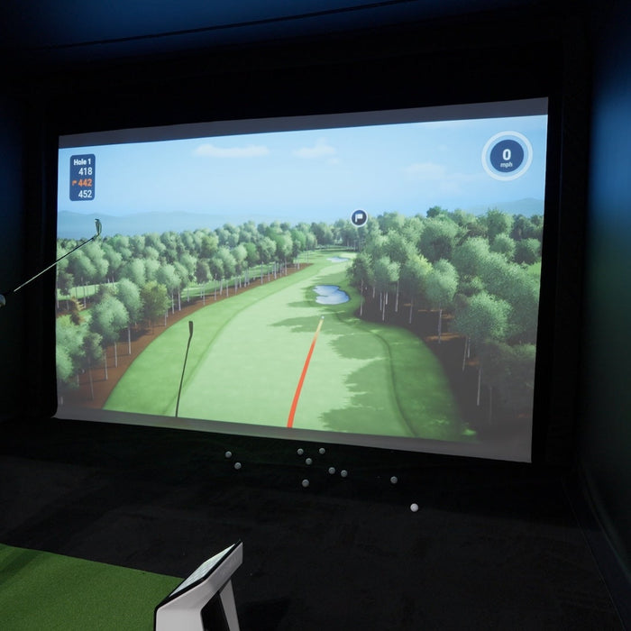 PlayBetter golf sim expert Daniel in the Garmin golf simulator trying out the upgraded Home Tee Hero software with an R50 and R10 at the 2026 PGA Show