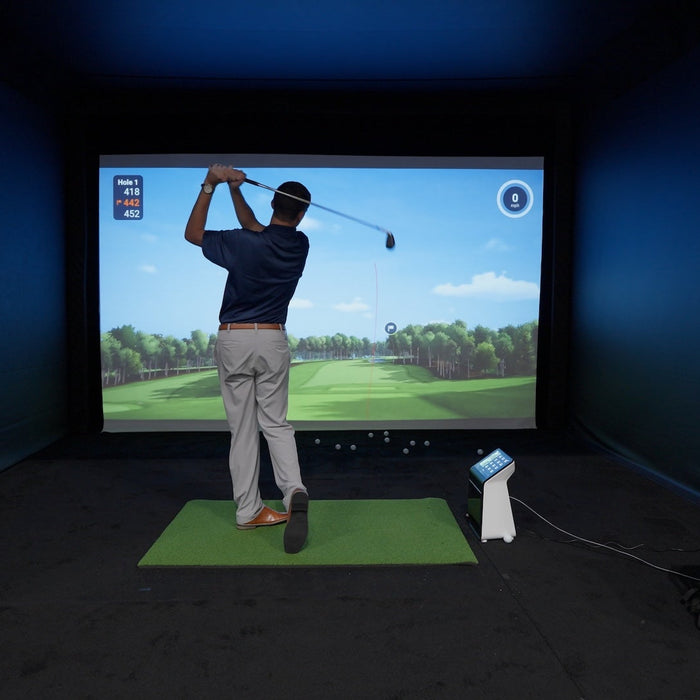 Daniel post swing in the Garmin Approach R50 golf simulator at the PGA Show