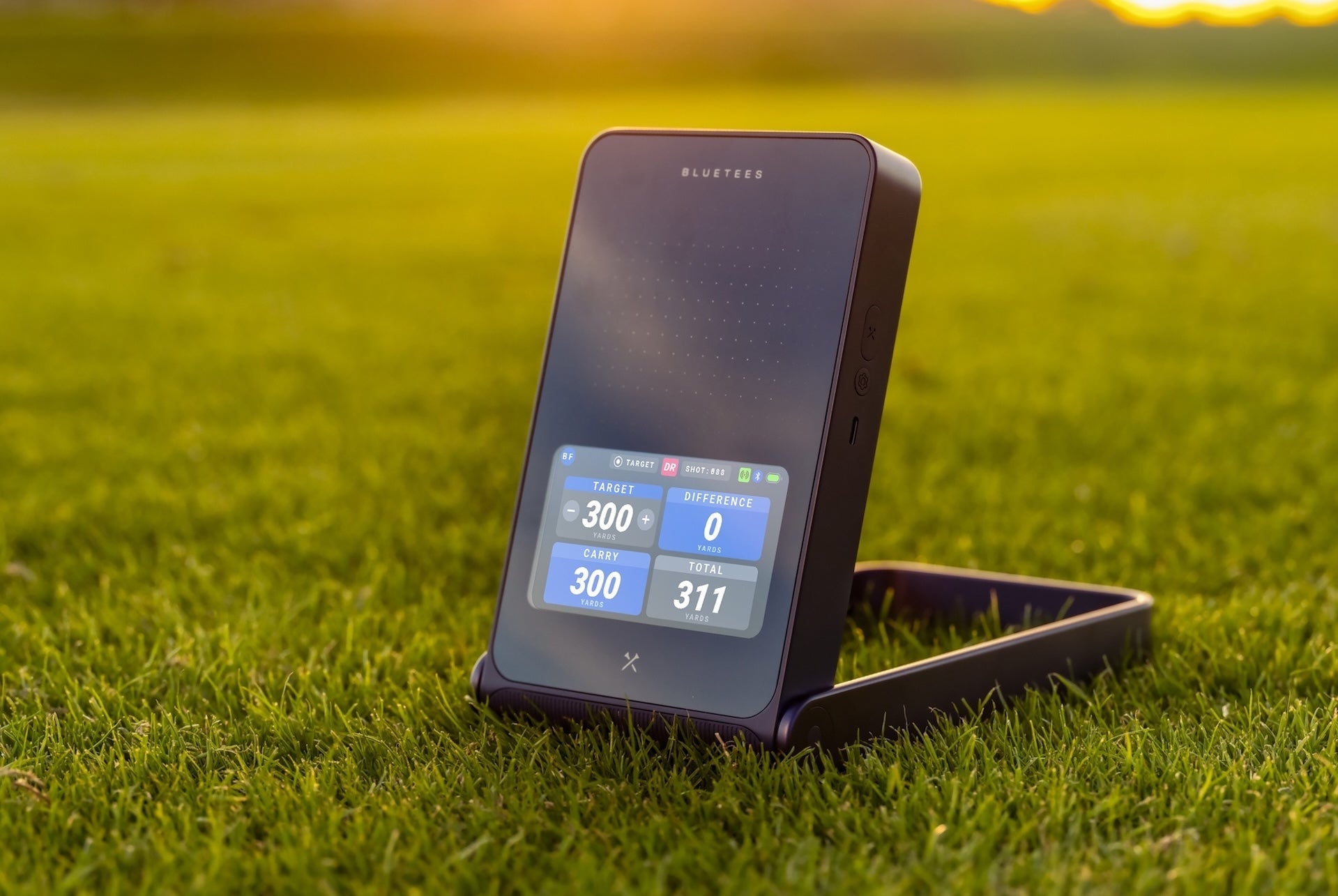 The Blue Tees Rainmaker with four data points on the display on the golf course