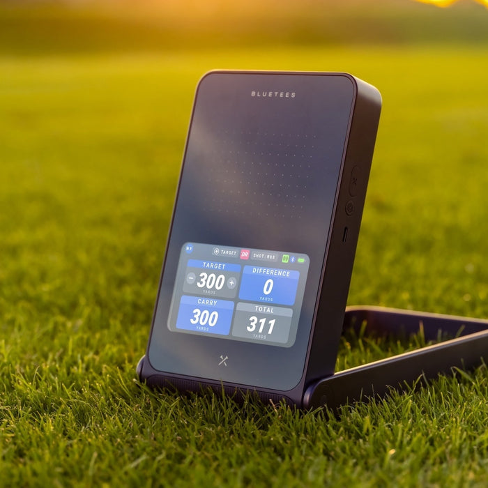 The Blue Tees Rainmaker with four data points on the display on the golf course
