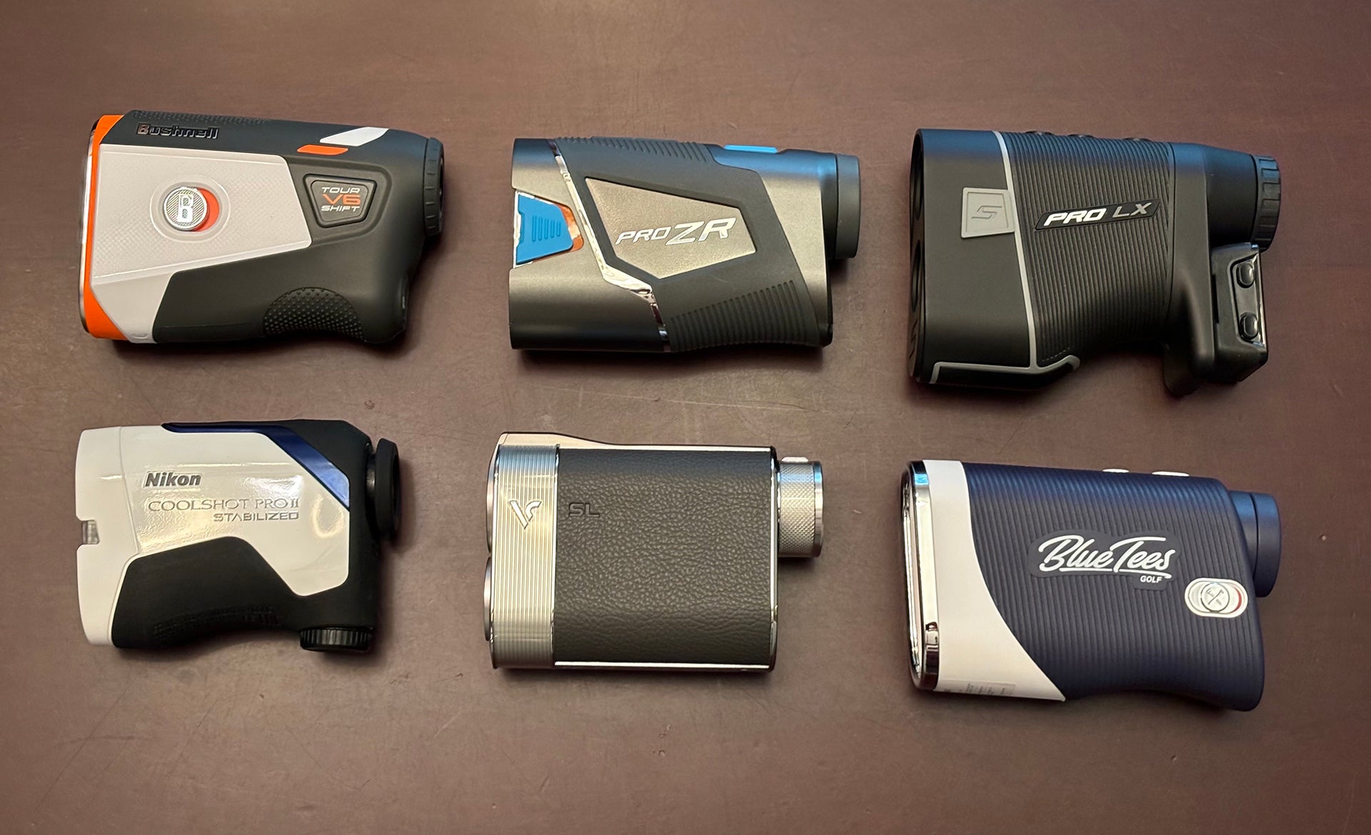 Six of the best golf rangefinders of 2024 laying on a table