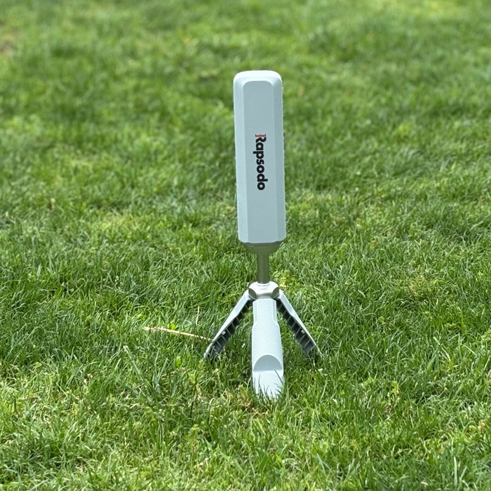 The Rapsodo MLM2PRO launch monitor and golf simulator on the grass at the golf hitting range