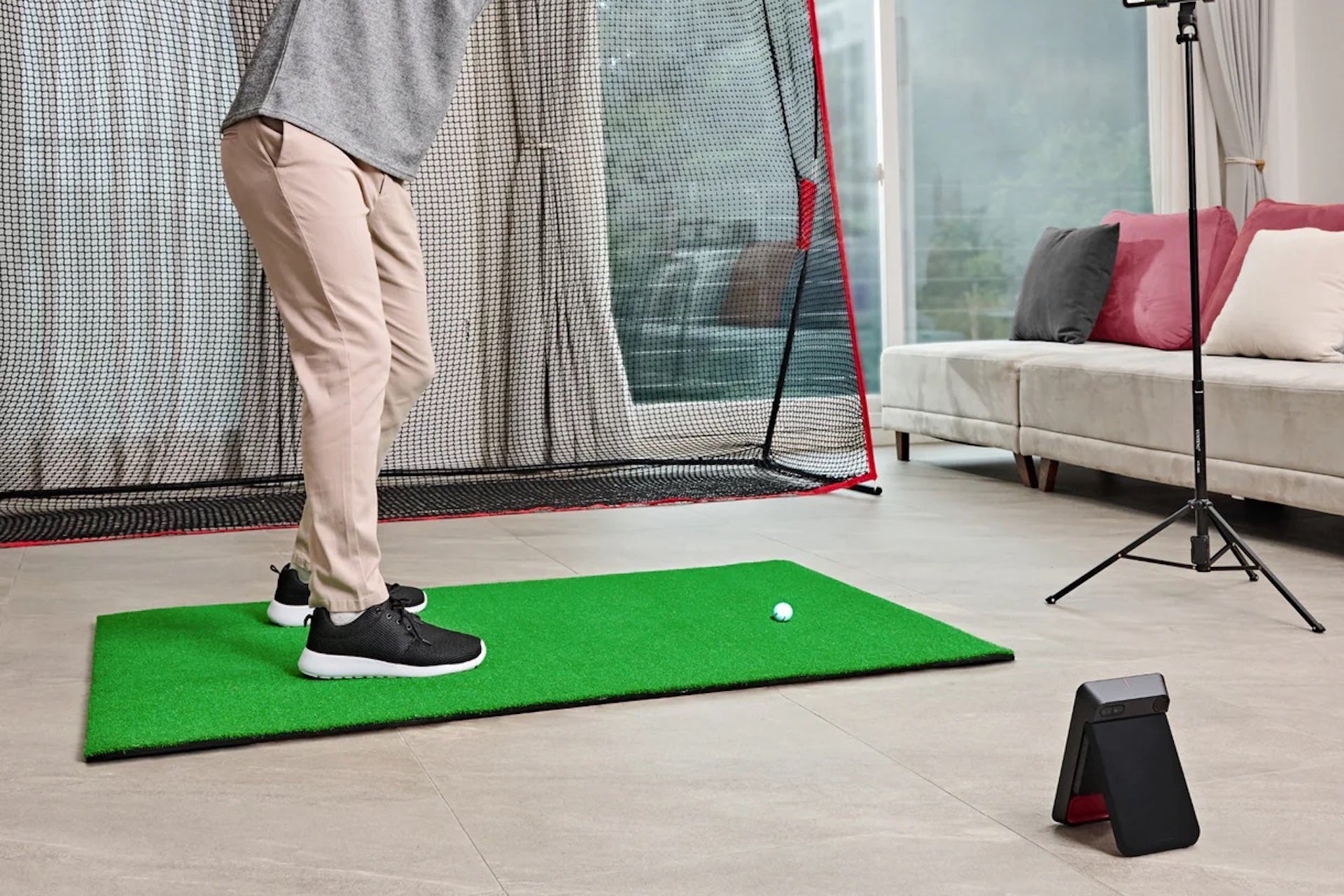The Swing Caddie SC4 Pro in a home golf sim setup
