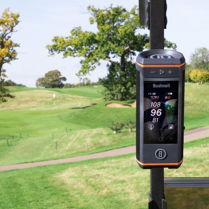 Front view of the Bushnell Wingman HD golf speaker on the cart bar at a golf course