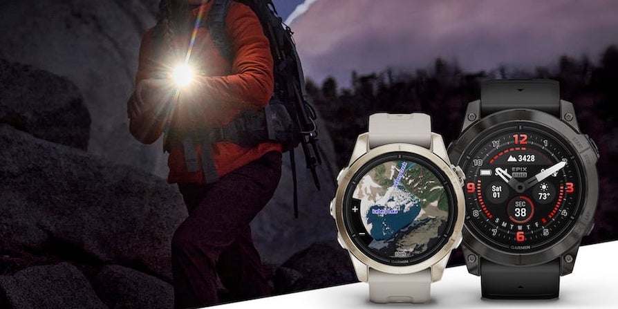 A woman on a trail at night in the background, wearing a Garmin epix Pro with the flashlight on, with two different sizes of the GPS watches in the foreground