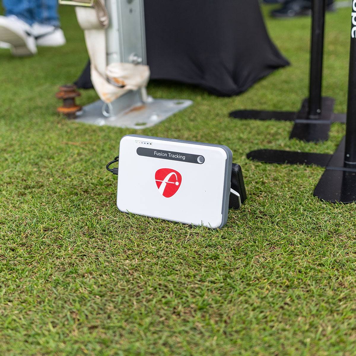 The FlightScope Mevo+ Limited Edition launch monitor on the grass at a range at demo day at the 2024 PGA Show
