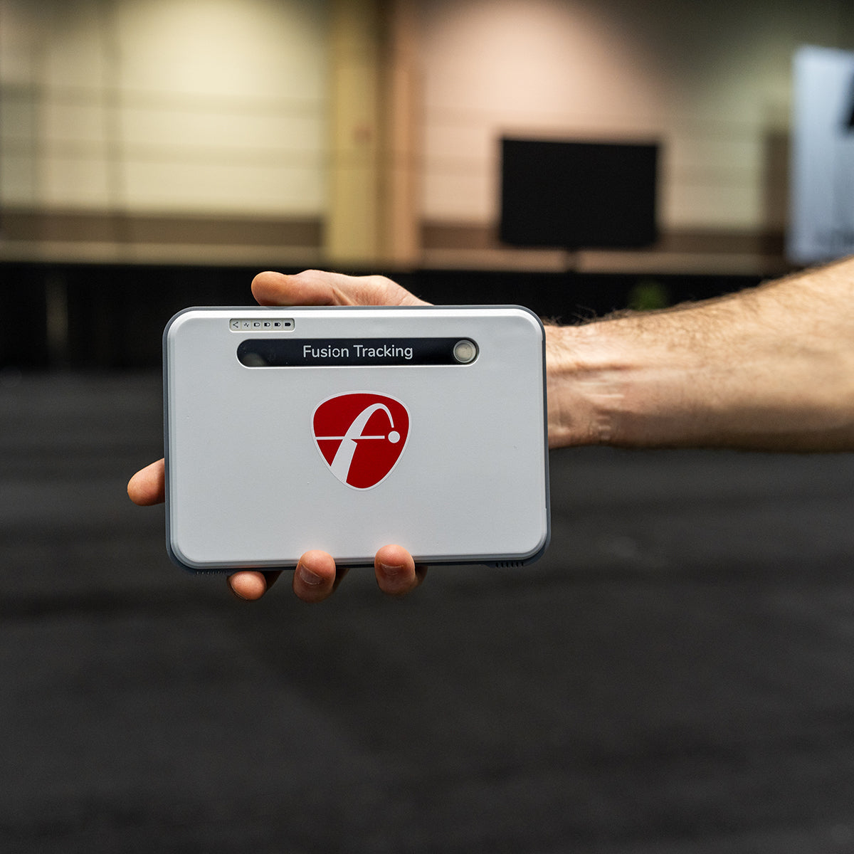 The FlightScope Mevo+ Limited Edition held in a hand at the 2024 PGA Show