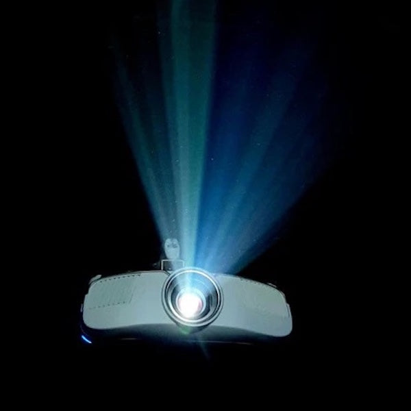 Front view of a golf projector with light shining out