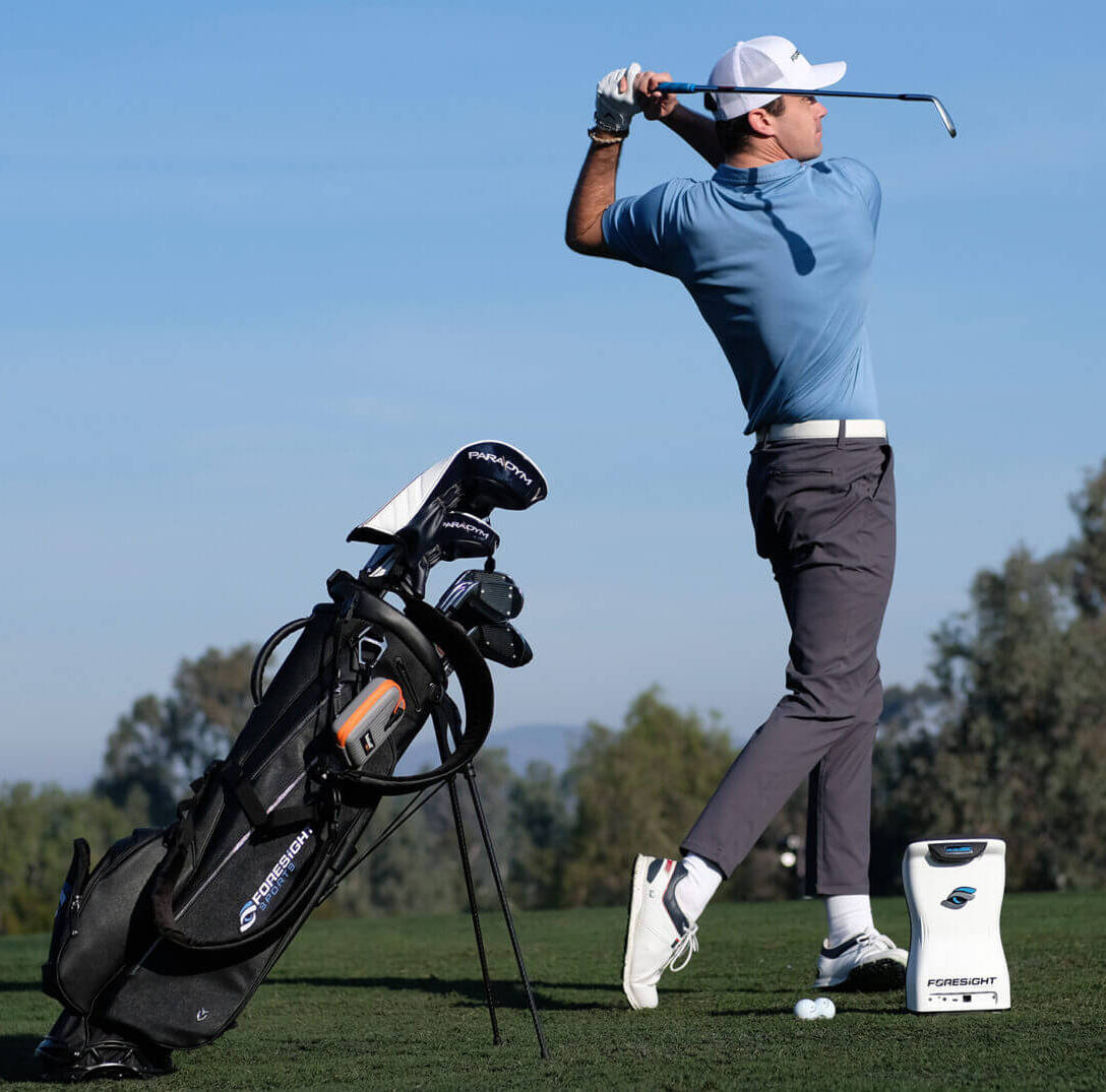 Golfer after swinging on the range with a Foresight QuadMAX launch monitor